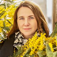 Portrait of a young woman with a bouquet of mimosa in her hands. Spring Portrait of a young woman with a bouquet of mimosa in her hands. Spring